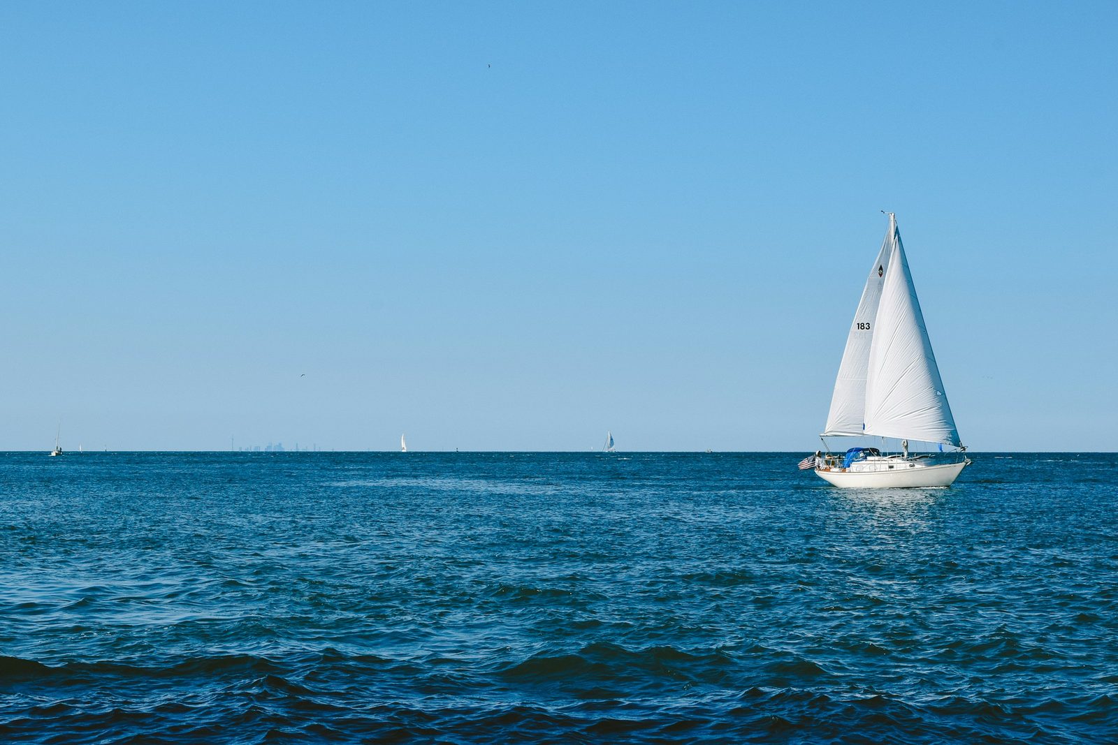 A cruising yacht under full sail on open water